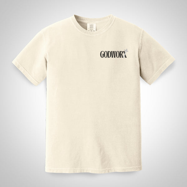 Ivory t-shirt with 'GODWORX' logo on a light gray background