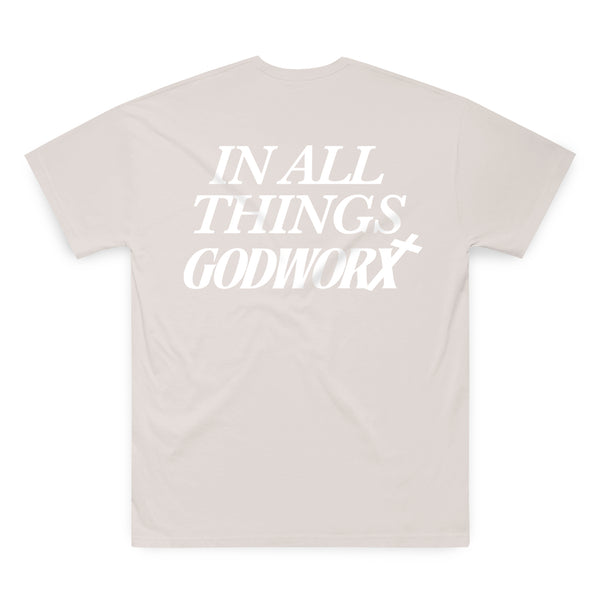 Beige christian shirt with 'IN ALL THINGS GODWORX' text on a white background