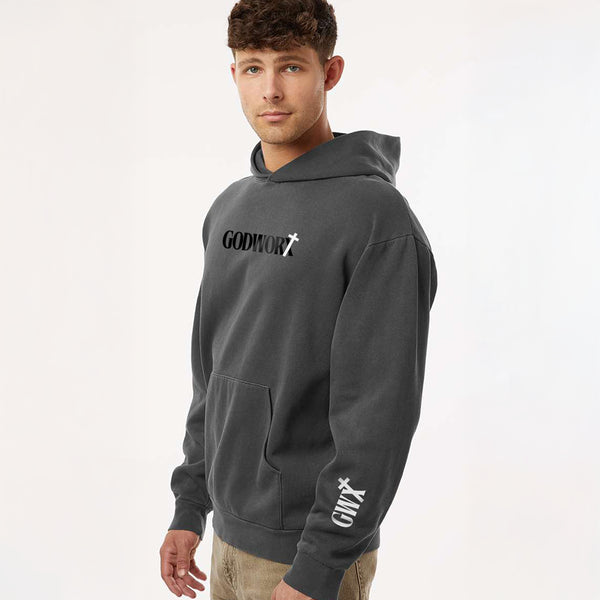man wearing a christian hoodie with a godworx logo on the chest and gwx logo on the lower sleeve